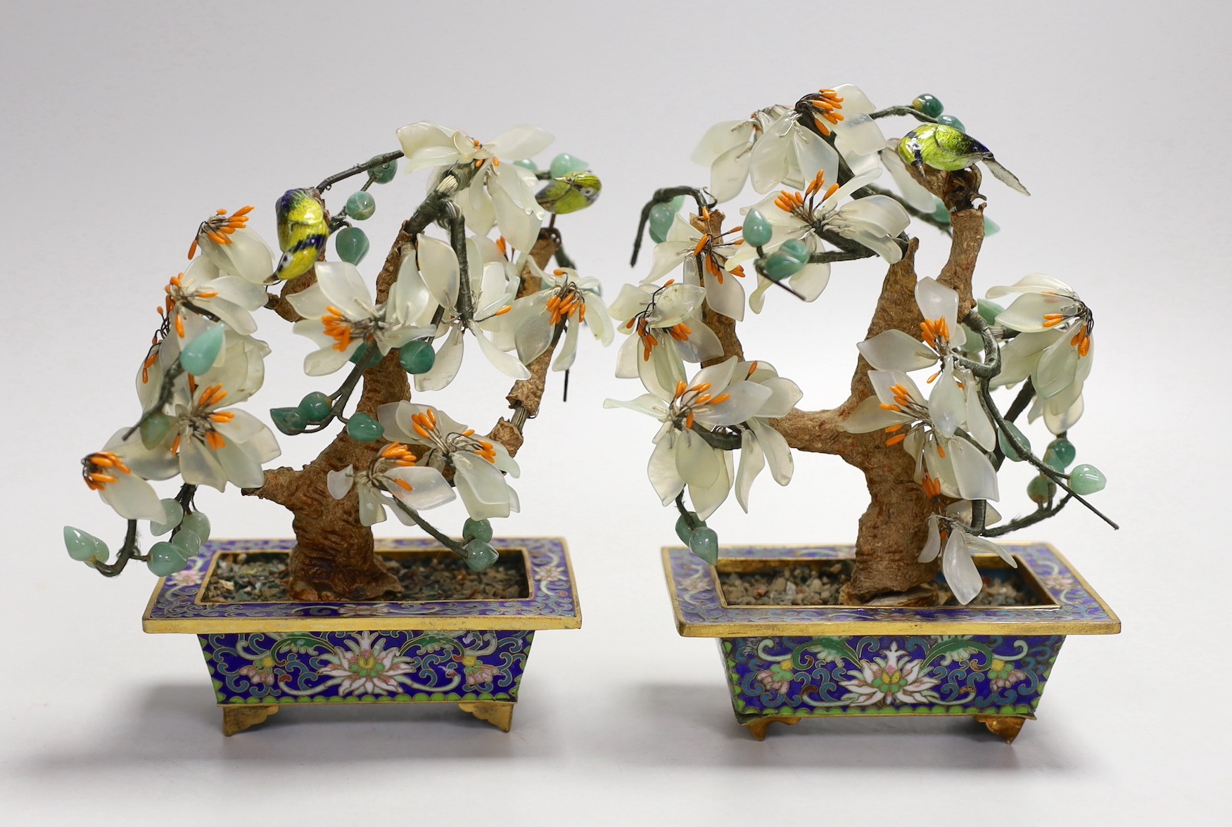 A pair of Chinese hardstone jardinières and a pair of champleve enamel candlesticks, tallest 16cm